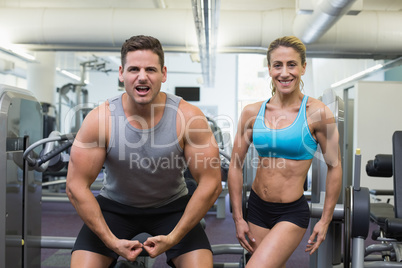 Bodybuilding man and woman posing for the camera