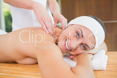 Smiling woman getting a back massage