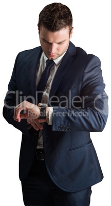 Handsome businessman checking the time