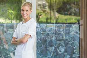 Blonde beauty therapist smiling at camera