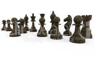 Black wooden chess pieces standing