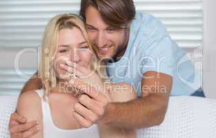Handsome man proposing marriage to his surprised girlfriend