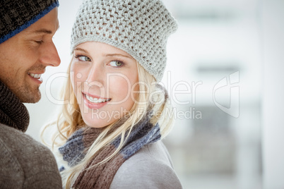 Couple in warm clothing hugging
