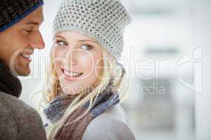 Couple in warm clothing hugging