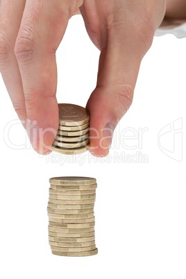 Businessman counting his pile of coins