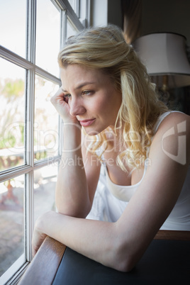 Pretty blonde sitting by the window