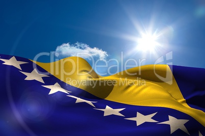Bosnian national flag under sunny sky