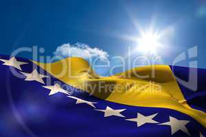 Bosnian national flag under sunny sky