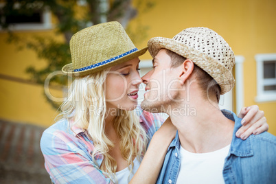 Hip young couple about to kiss