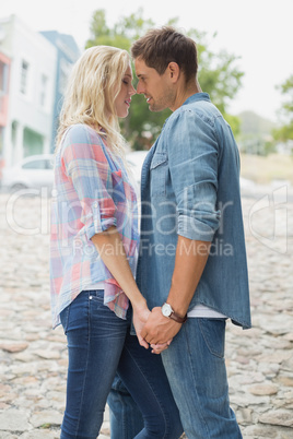 Hip young couple about to kiss