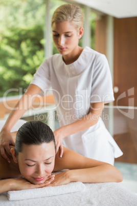 Brunette enjoying a peaceful massage