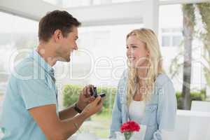Man proposing marriage to his blonde girlfriend