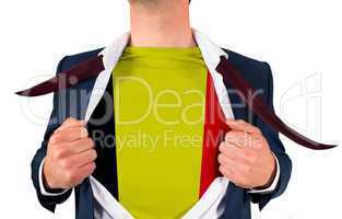 Businessman opening shirt to reveal belgium flag