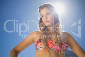 Beautiful blonde in floral bikini on the beach