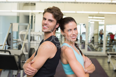 Fit attractive couple smiling at camera