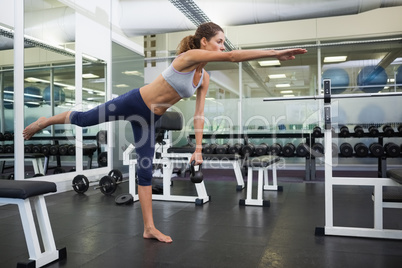 Fit woman working out with kettlebell Fit woman working out with kettlebell