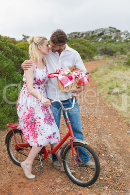 Cute couple going for a picnic kissing each other