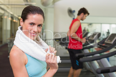 Smiling brunette with towel over shoulders