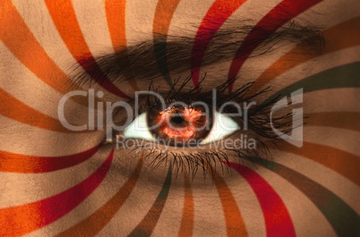 Orange eye on patterned face