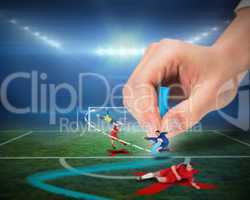 Hand drawing tactics on football pitch during match