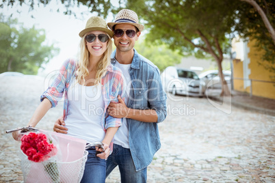 Hip young couple going for a bike ride