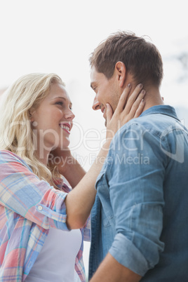 Cute young couple standing and facing each other