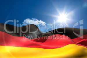 German national flag under sunny sky