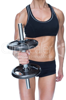 Female strong bodybuilder holding large black dumbbell