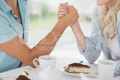 Cute couple having coffee together in cafe