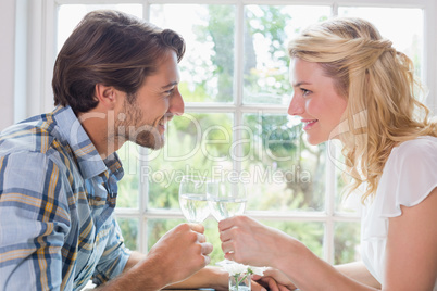 Cute smiling couple having a meal together