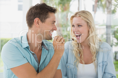 Hip young couple having desert together