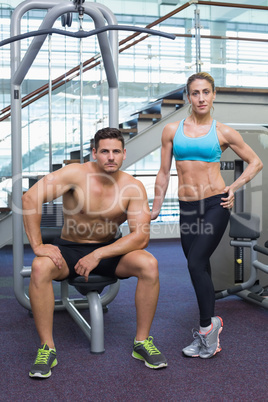 Bodybuilding man and woman posing for the camera