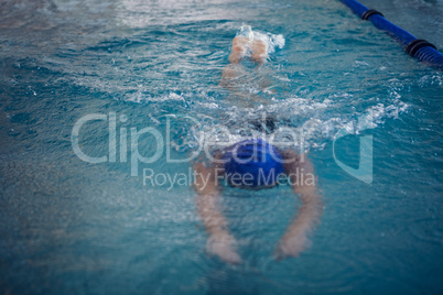 Fit woman swimming in the pool