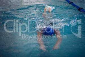 Fit woman swimming in the pool