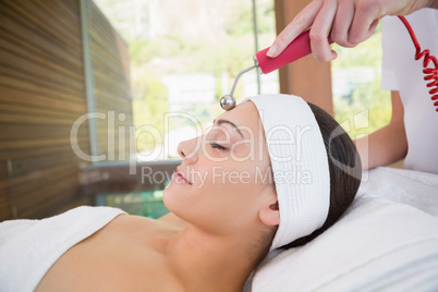 Peaceful brunette getting micro dermabrasion