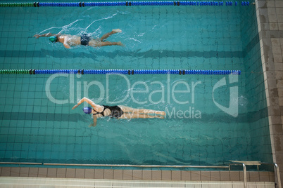 Man and woman swimming in the pool