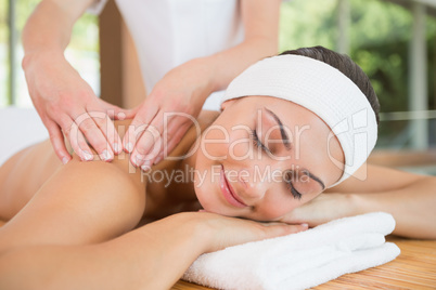 Smiling woman getting a back massage