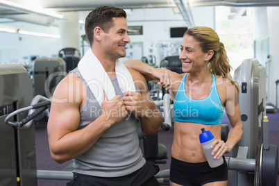 Bodybuilding man and woman chatting together