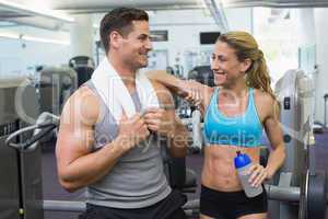 Bodybuilding man and woman chatting together
