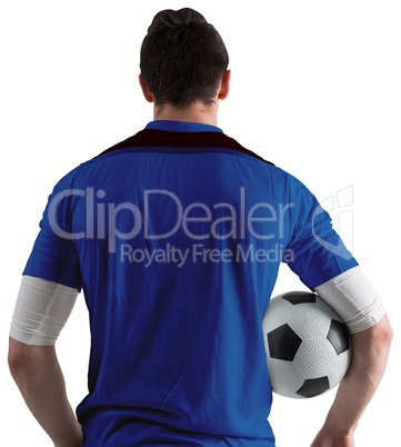 Football player in blue holding ball