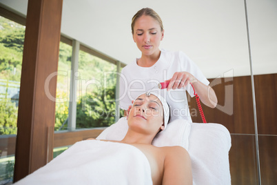 Peaceful brunette getting micro dermabrasion