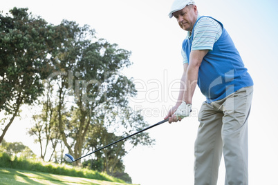 Golfer holding his golf club