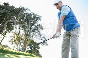 Golfer holding his golf club