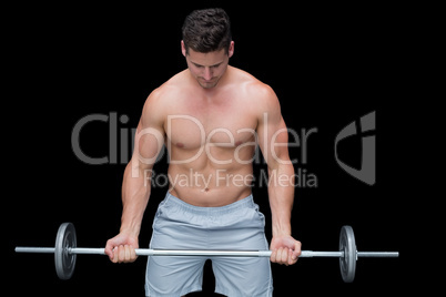 Serious crossfitter lifting up barbell Serious crossfitter lifting up barbell
