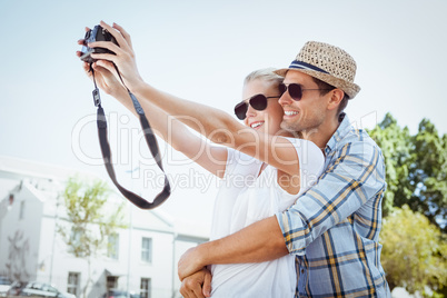Stylish young couple taking a selfie