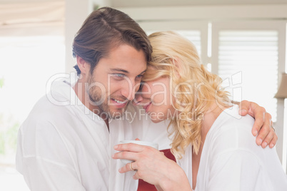 Couple having breakfast in their bathrobes