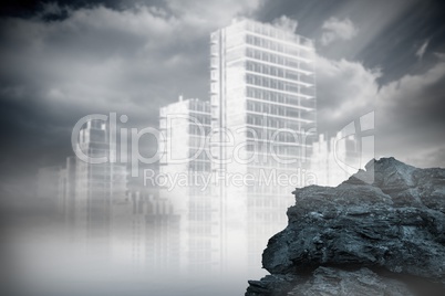 Large rock overlooking outline of city