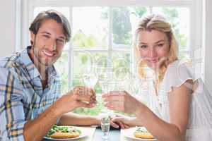 Cute smiling couple having a meal together
