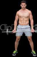 Serious handsome crossfitter lifting up barbell