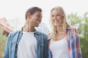 Hip young couple laughing together